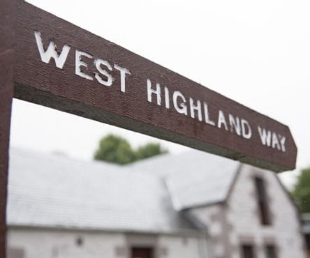 Hiking sign of the West Highland Way at Beinglas Farm