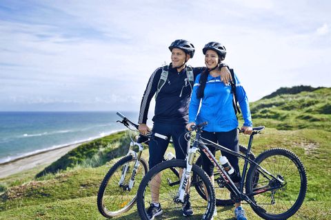 Cycling couple near Oeresund