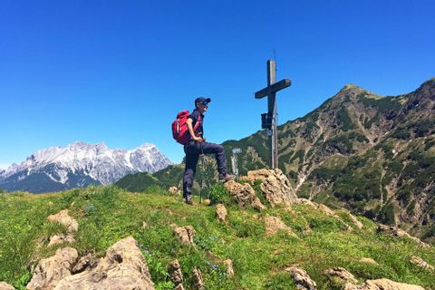 Hiker on a peak of the Kitzbuehel Alps