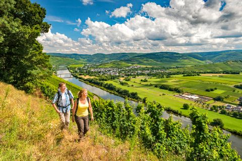 Hiker with a fantastic panoramic view on the Mosel