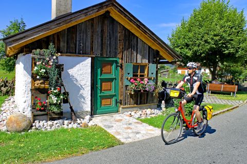 Cyclist in front of wooden cot
