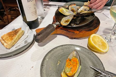 Lapas - limpets served sizzling in a hot iron pan on Madeira