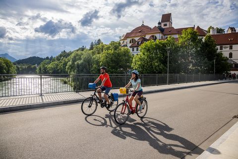 Cyclist on a bridge in Füssen