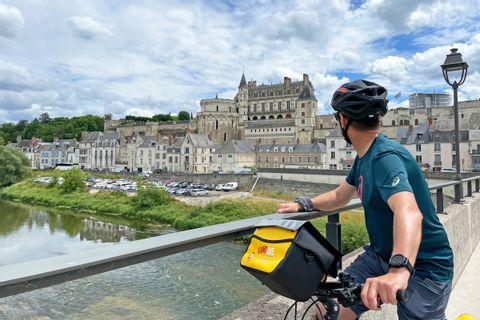 Cyclist watching Castle Amboise