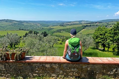 Hiker with the view of beautiful San Leolino in Tuscany