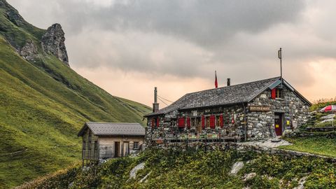 Spectacular location of the Rotstockhütte, a stone house on the Bärentrek