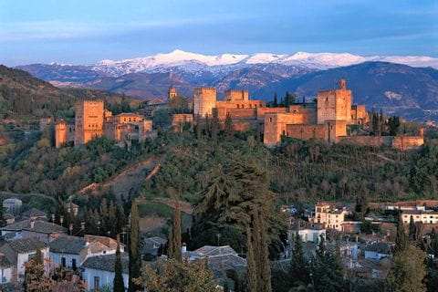 Alhambra in front of snowy mountains